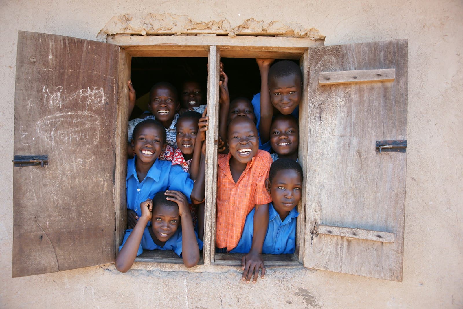 Pupils gathered at a classroom window